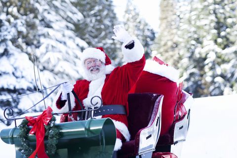 Santa Claus Sitting in His Sleigh Waving