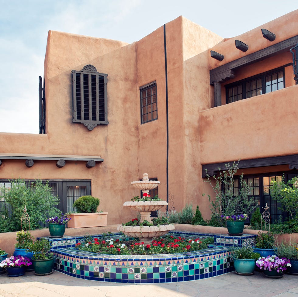 santa fe adobe house with fountain