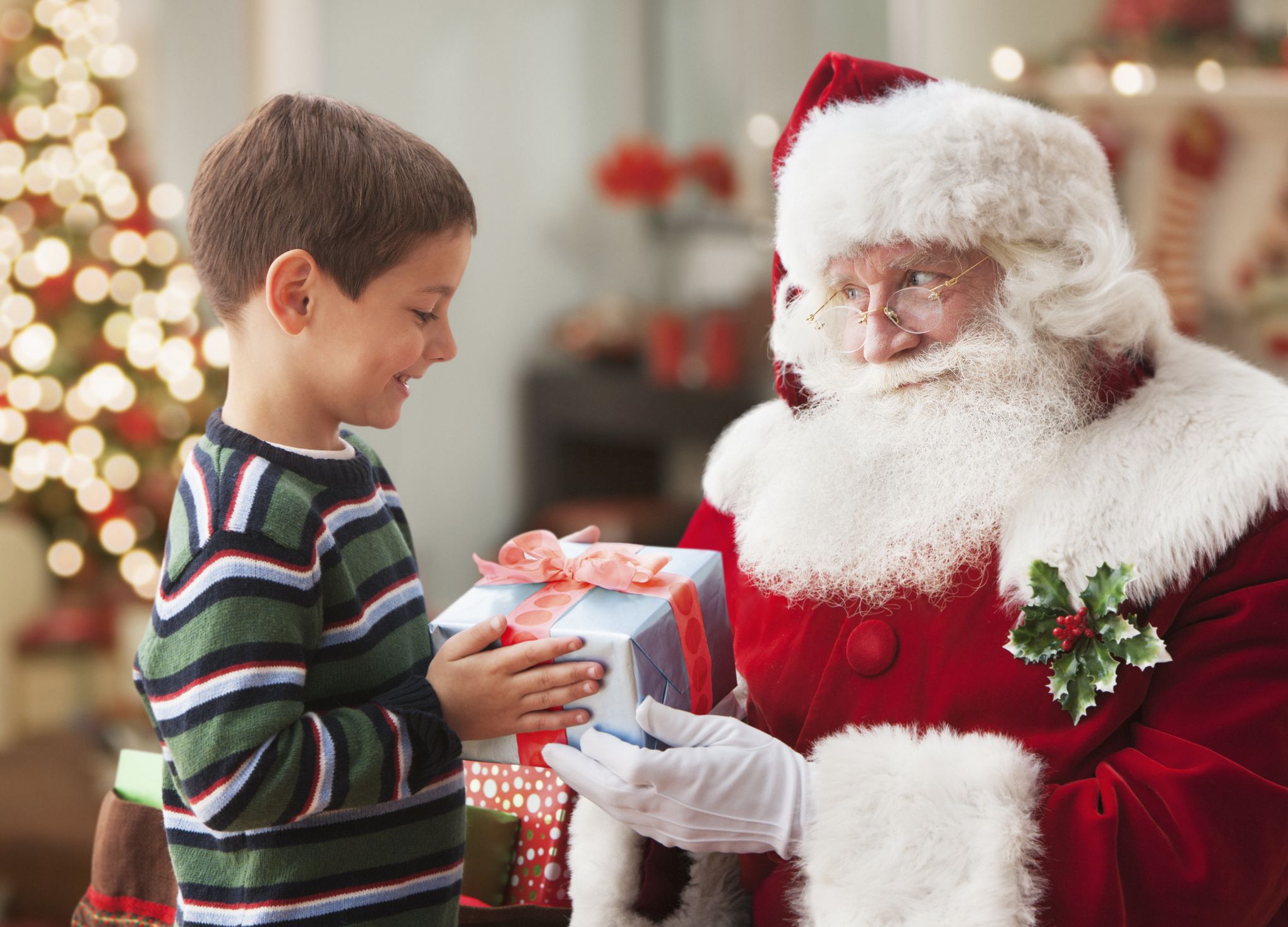 Santa Claus Giving Gifts To Children