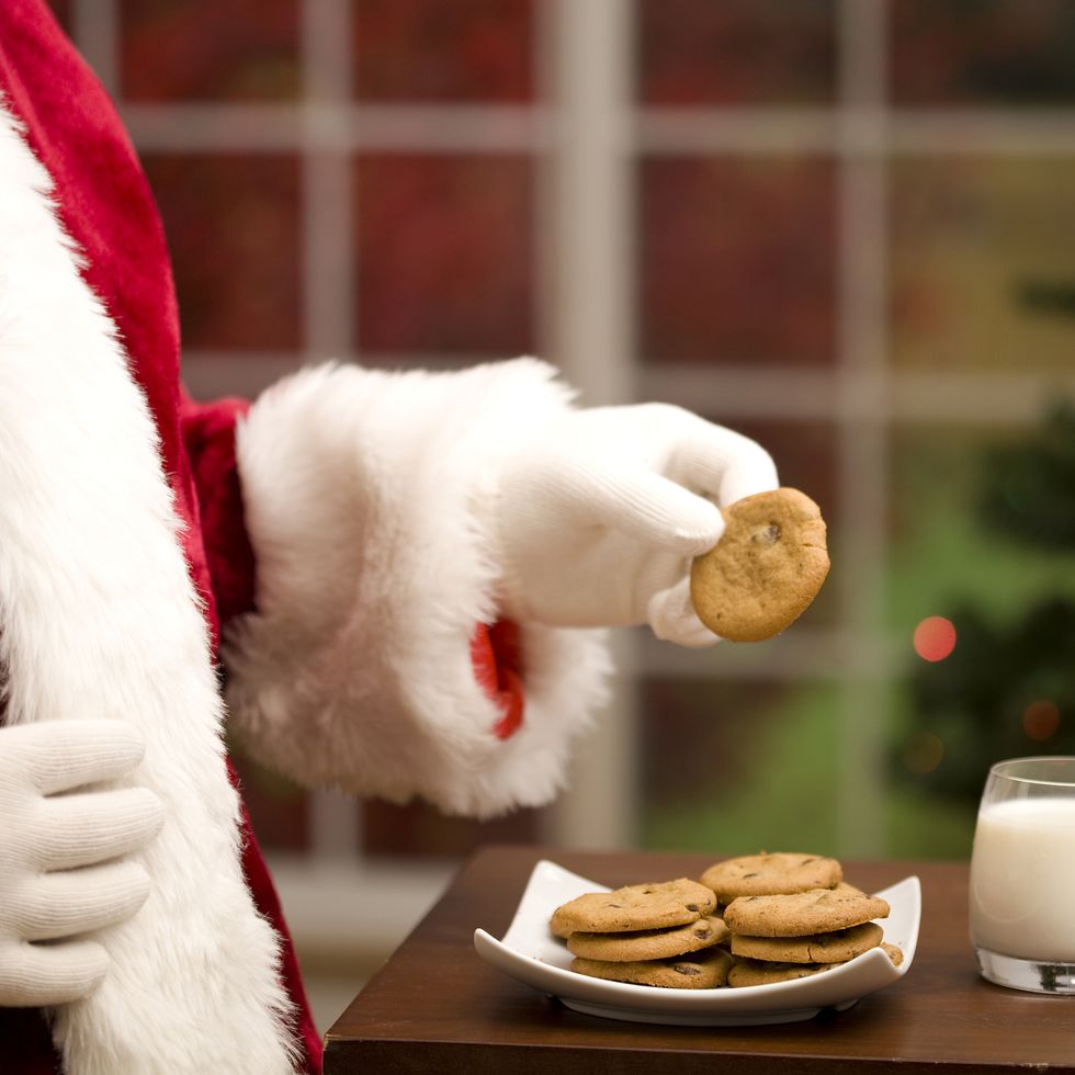 a plate of cookies and a glass of milk is left out for santa clausefor more christmas photos look in the lightbox below