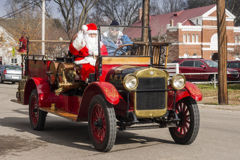santa waves from a vintage firetruck