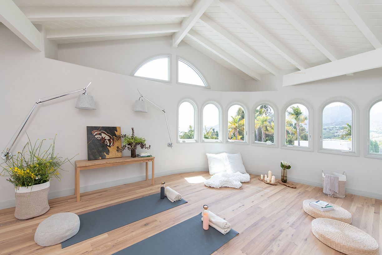 Minimalist yoga studio with a serene atmosphere and natural light