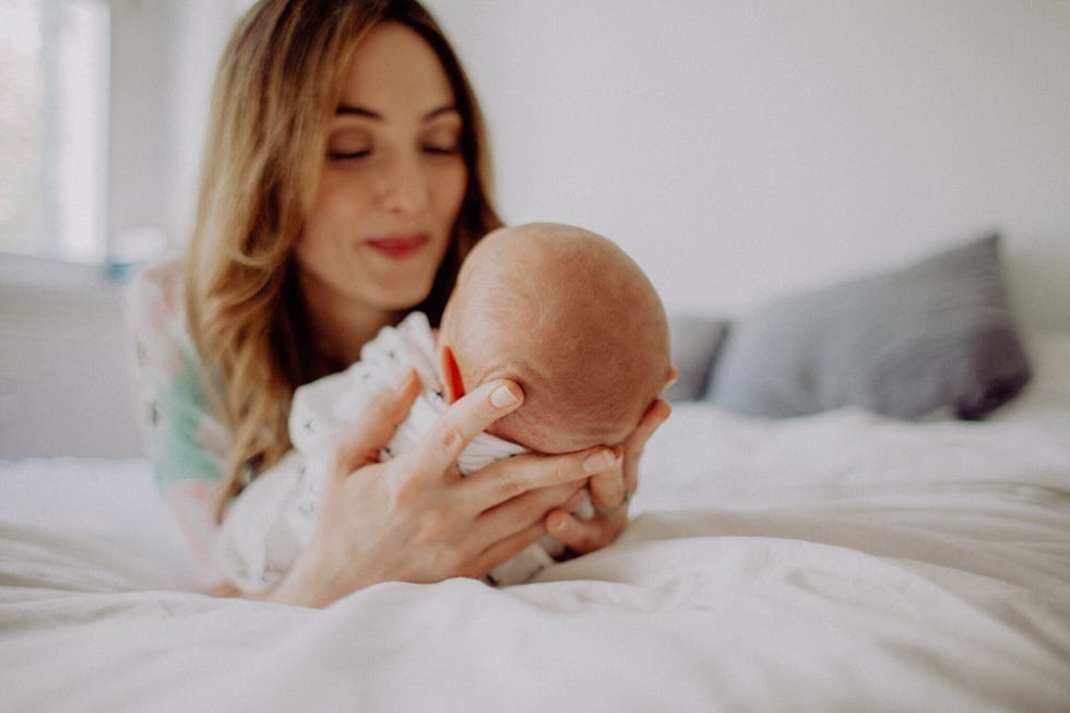 a woman and a newborn