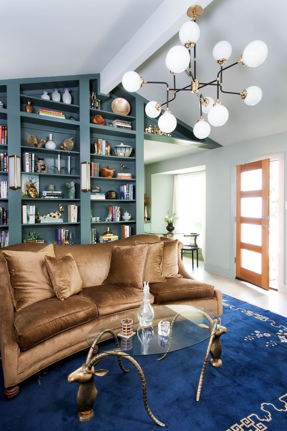 a living room with a couch and a bookcase