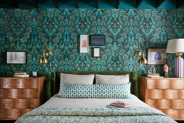 a bed with a green wall