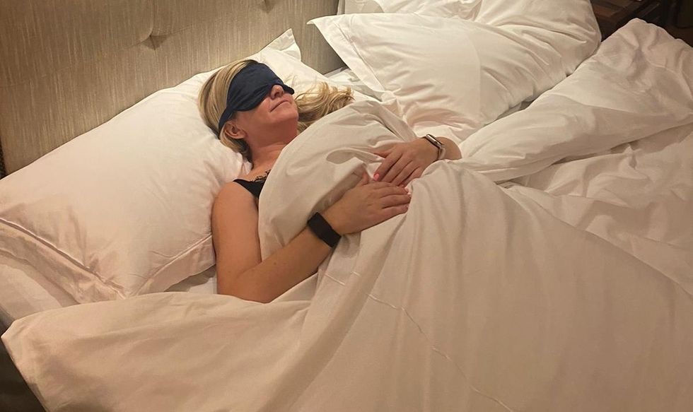 a person lying in a bed