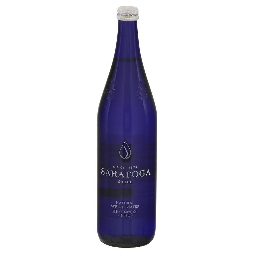 blue glass bottle of saratoga still natural spring water