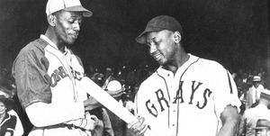 kansas city   1942  satchel paige of the monarchs talks with josh gibson of the homestead grays before a game in kansas city in 1941  photo by mark ruckertranscendental graphics, getty images