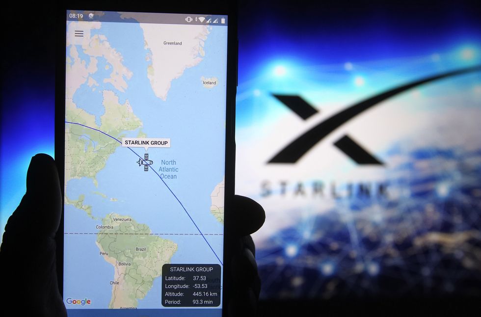 a satellite tracker image is seen displayed on a smartphone