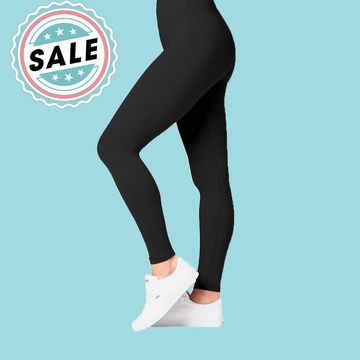 legs wearing satina high waisted leggings next to a sale sign in front of a blue background