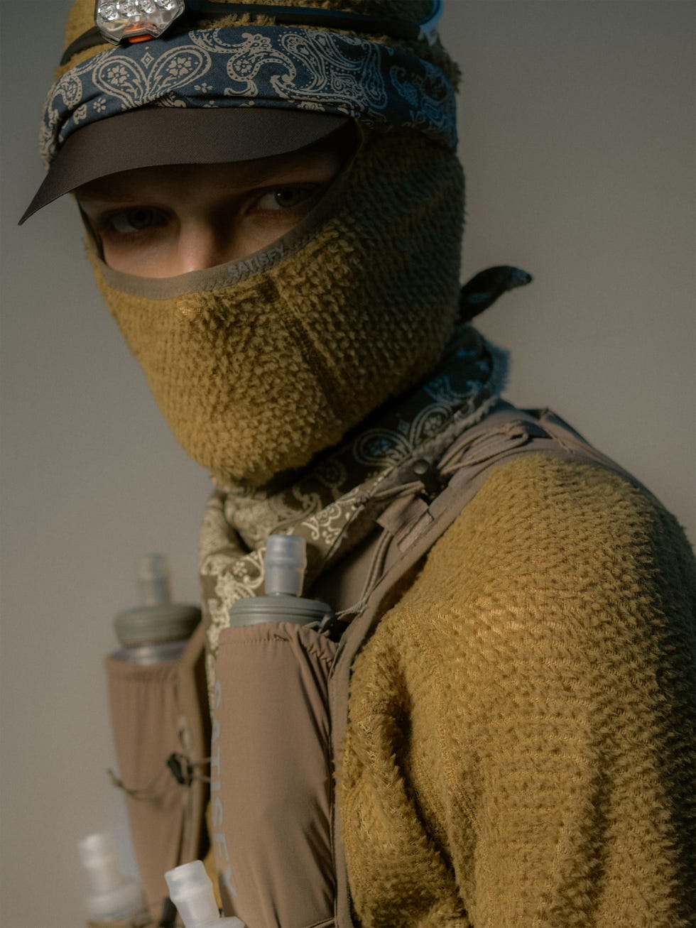 individual wearing tactical gear and hydration system