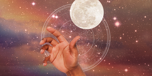 a hand reaches out over a starry sky and a full moon