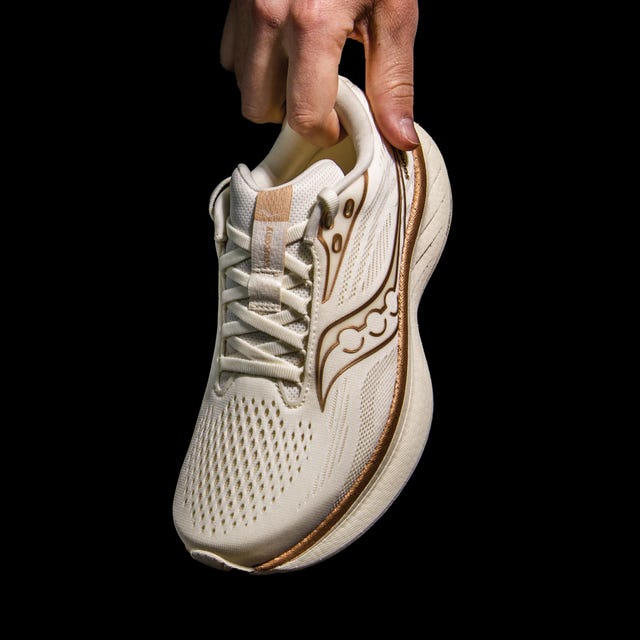 running shoe held by a hand
