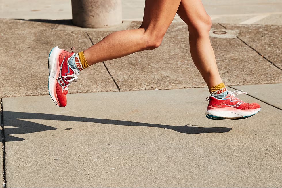 running shoes and socks in motion on pavement