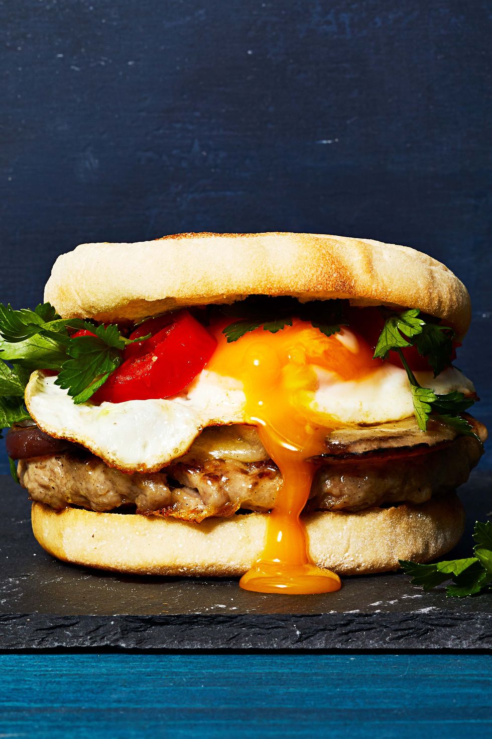 sausage and egg sandwich with egg oozing out