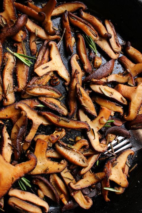 garlic rosemary sautéed mushrooms in a black cast iron skillet, buttered, salted, and peppered