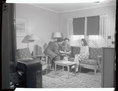 housing official with women in living room