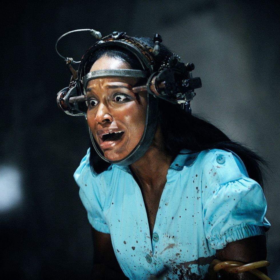 a woman's head is trapped in a device in a scene from saw vi