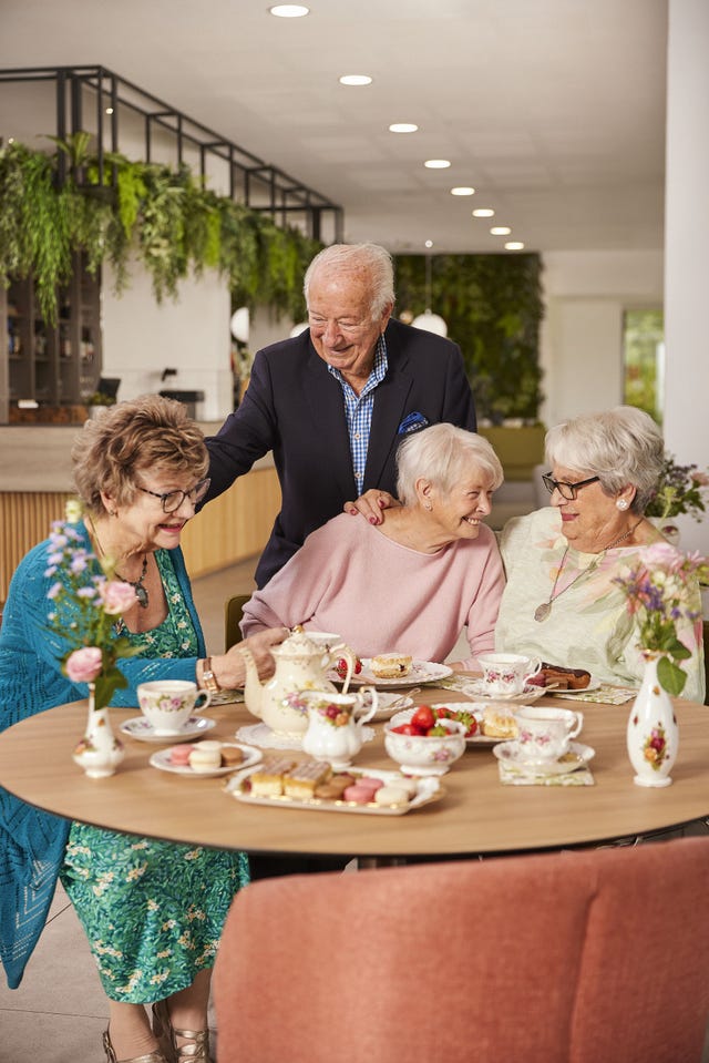 group of retirees having afternoon tea