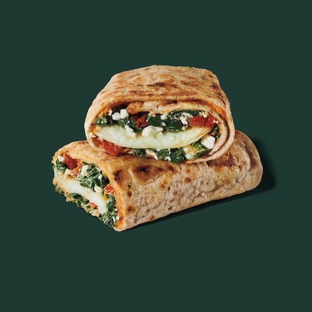 two rolled flatbreads filled with vegetables and cheese