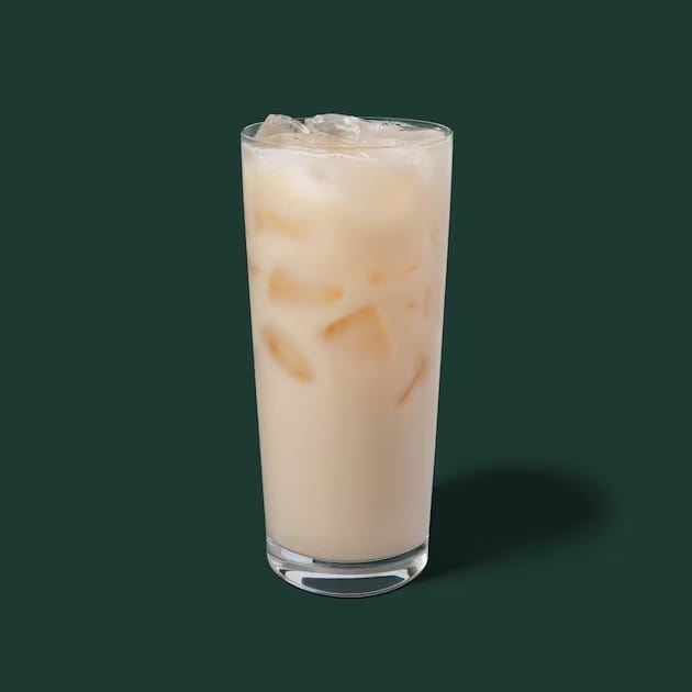 cold beverage with ice cubes in a tall glass