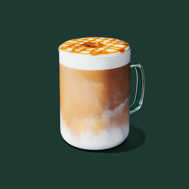 a glass mug with a liquid in it
