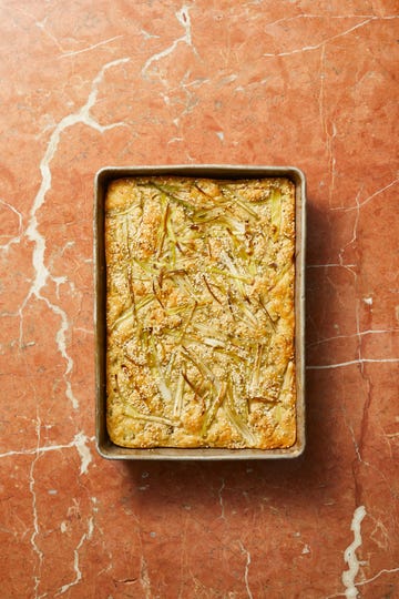 scallion and sesame focaccia on a terra cotta background