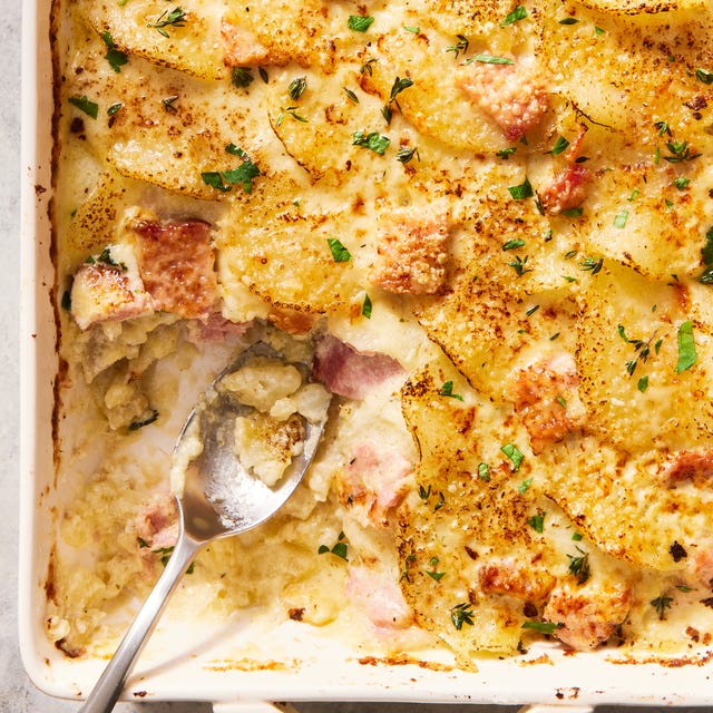 scalloped potatoes and ham in a white casserole dish