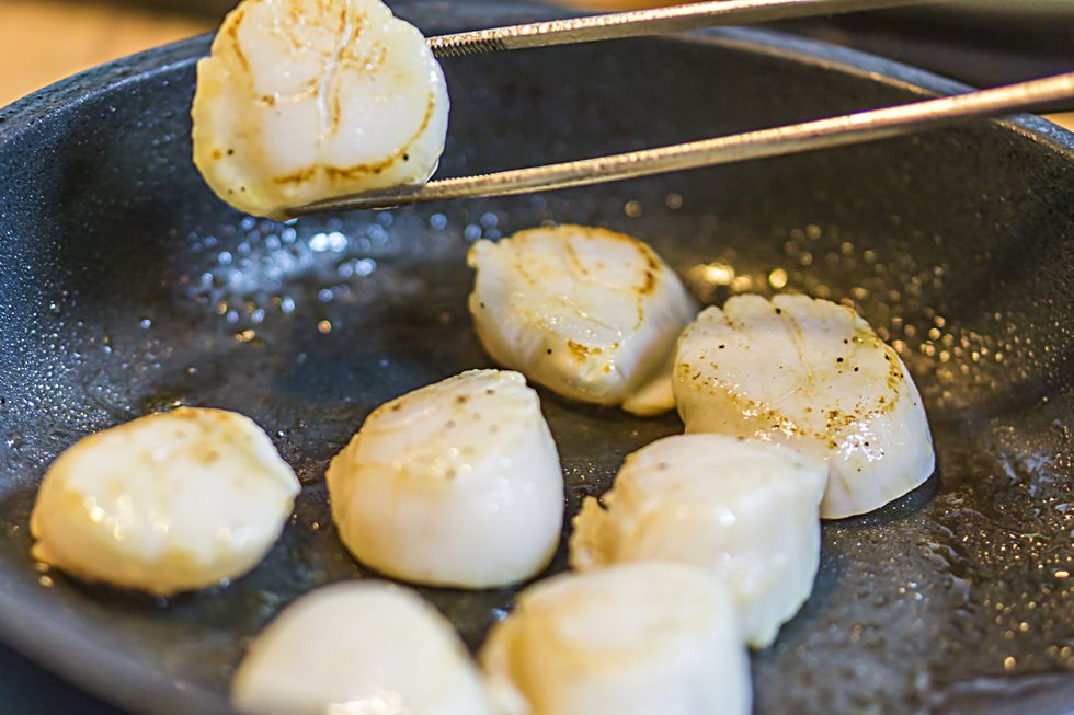 drain scallops and fry in a pan