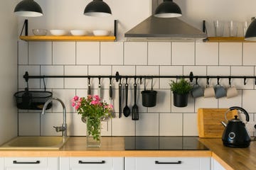 scandinavian kitchen interior with roses bouquet in vase