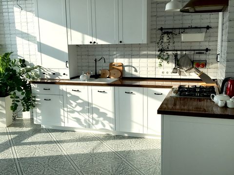 scandinavian style white cozy kitchen bathed in sunlight