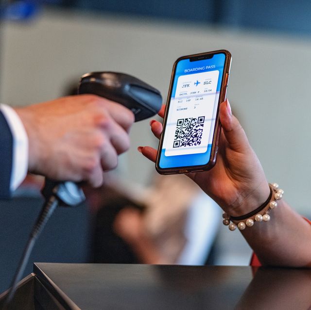 person scanning boarding pass on someone's smartphone