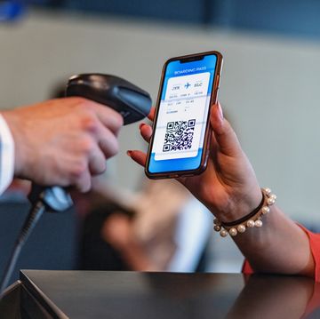 person scanning boarding pass on someone's smartphone