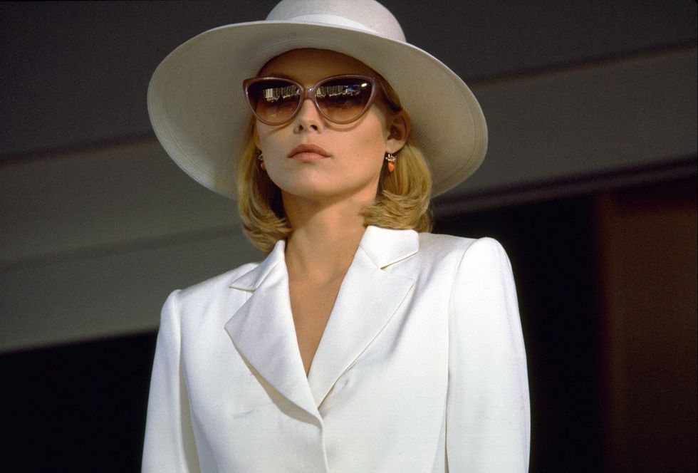 woman wearing white hat and sunglasses