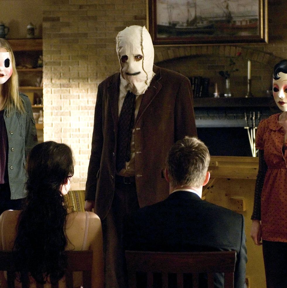 scary couples costumes man and woman in masks from the 'the strangers'