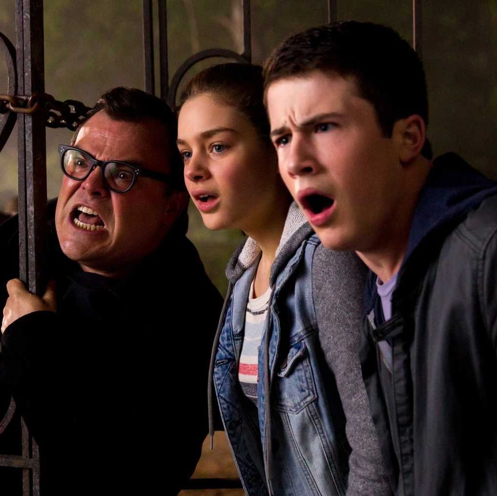 rl stine dylan and hanna look shocked in a scene from goosebumps a good housekeeping pick for best scary movies for kids