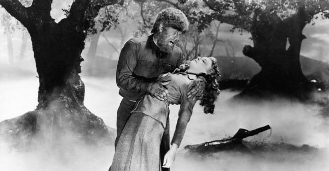 a scene depicting a werewolf holding a woman in a misty forest