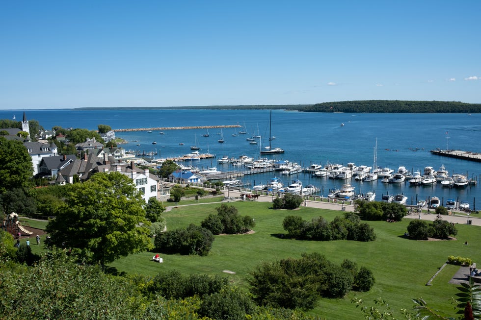 scenic view of beautiful landscape,high angle view of boats moored at harbour against clear blue sky,mackinac island,michigan,united states,usa