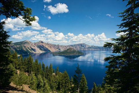 Scenic View Of Crater Lake Against Blue Sky