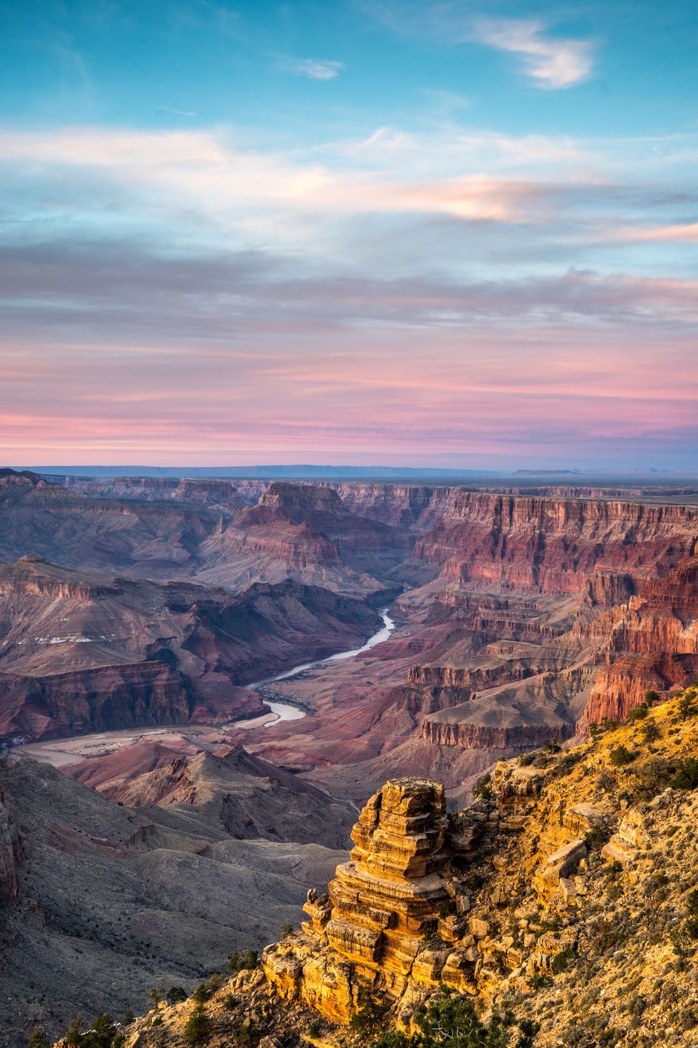scenic view of grand canyon national park  with sunset in background and river flowing through it