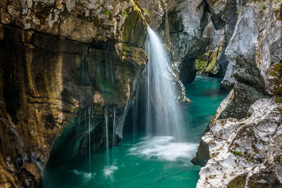 scenic view of waterfall in forest,bovec,slovenia