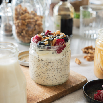 a jar of food with chia pudding and fresh berries