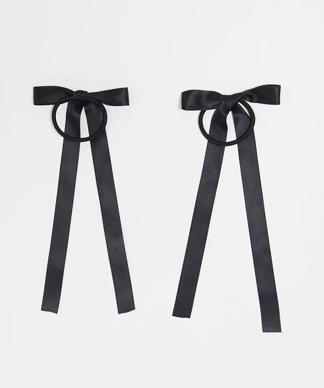 a pair of black bow ties