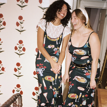 two women in dresses