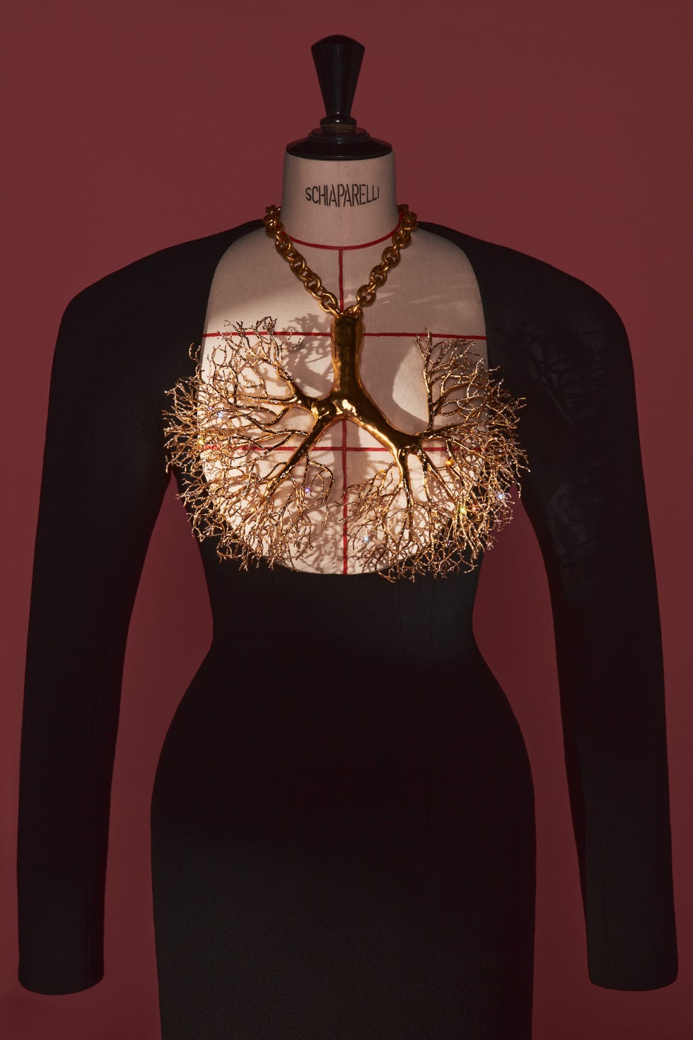 a couture sheath gown from daniel roseberry’s a/w 2021 schiaparelli collection