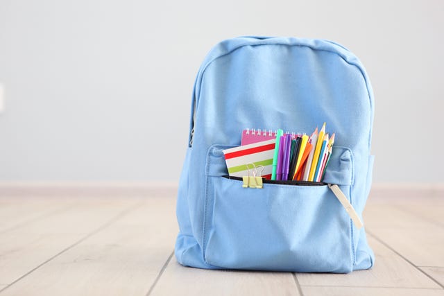 school backpack and stationery in a bright room preparing for school back to school place for text national school backpack awareness day