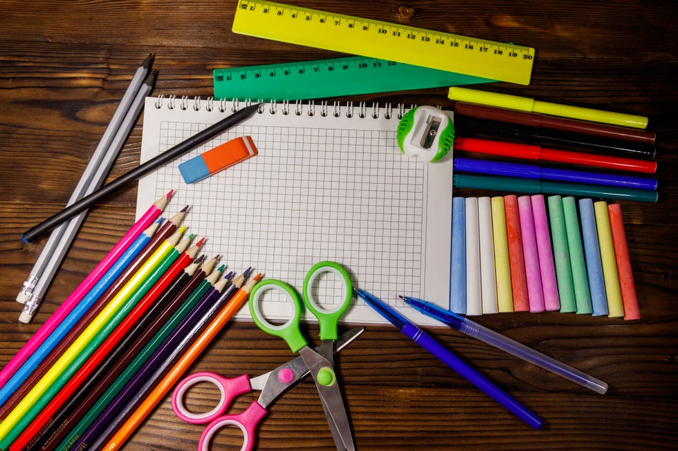 Set of school stationery supplies on wooden desk. Back to school concept