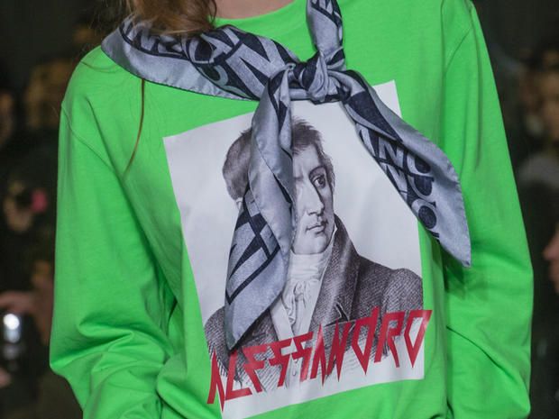 Green, Protest, Scarf, Outerwear, Hoodie, T-shirt, Fashion accessory, Jacket, 