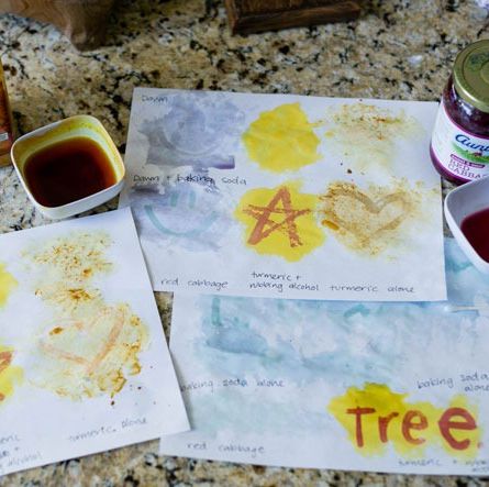 different messages and pictures are written in different substances to test out different color changing invisible inks as part of a science experiment for kids