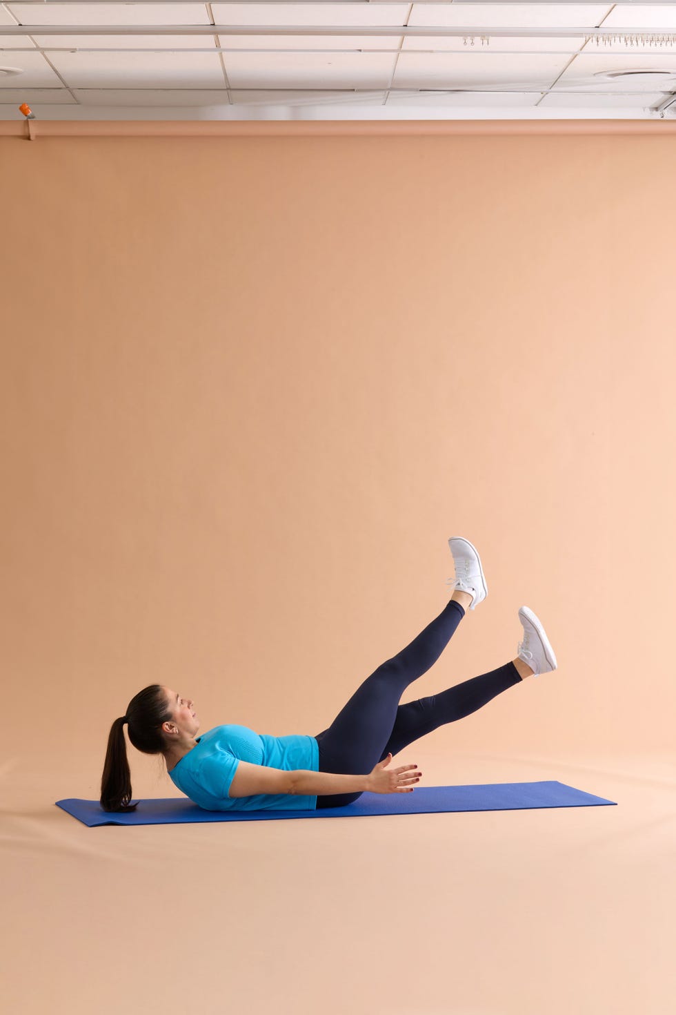 Individual performing an exercise on a yoga mat